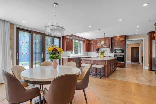 Chandelier, Dining room, Interior, Kitchen, Pendant Lights, Recessed Lighting, Stainless Steel Appliances, Wood Texture Flooring