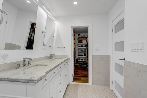 Bathroom, Dual Sink Vanities, Interior, Marble, Recessed Lighting, Walk-in Closets, Wood Texture Flooring
