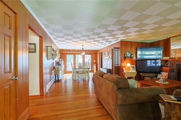 Dining room, Fireplace, Interior, Living room, Pendant Lights, Wood Texture Flooring, Wooden Walls