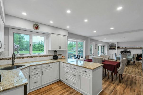 Dining room, Fireplace, Interior, Kitchen, Recessed Lighting, Stone Walls, Wood Texture Flooring