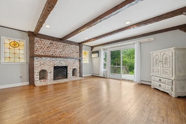 Empty room, Fireplace, Interior, Recessed Lighting, Stone Walls, Wooden Beams, Wood Texture Flooring