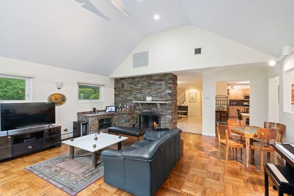 Dining room, Fireplace, Interior, Living room, Recessed Lighting, Stone Walls, Wood Texture Flooring