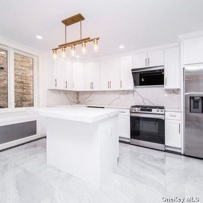 Interior, Kitchen, Marble, Marble Walls, Pendant Lights, Recessed Lighting, Stainless Steel Appliances
