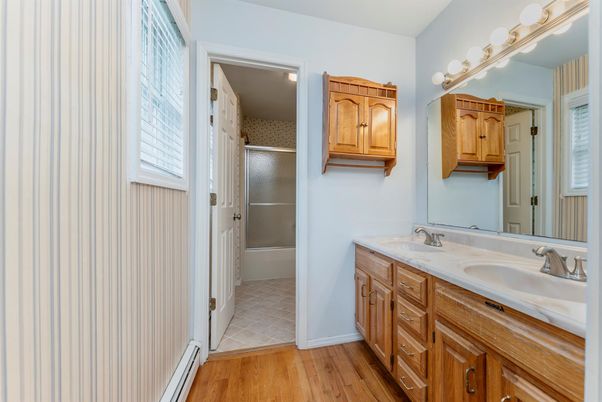 Bathroom, Dual Sink Vanities, Glass Shower, Interior, Wood Texture Flooring