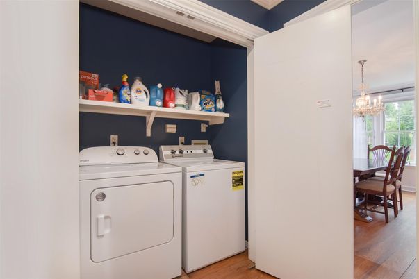 Chandelier, Dining room, Interior, Utility Closets, Washer, Wood Texture Flooring