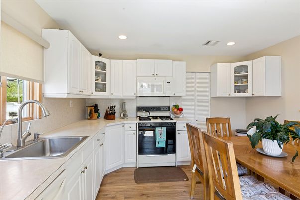 Dining room, Interior, Kitchen, Recessed Lighting, Stainless Steel Appliances, Wood Texture Flooring