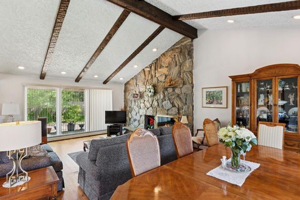 Dining room, Fireplace, Interior, Living room, Recessed Lighting, Stone Walls, Wooden Beams, Wood Texture Flooring