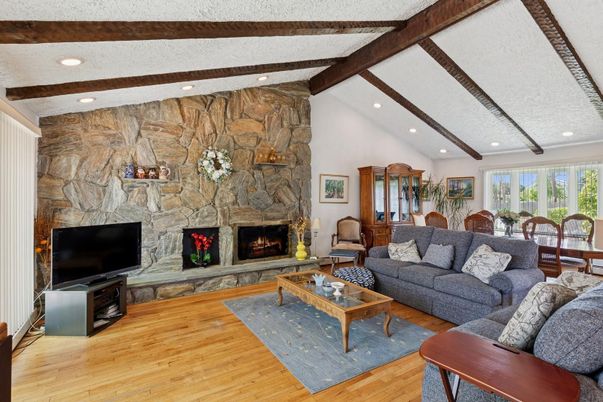 Dining room, Fireplace, Interior, Living room, Recessed Lighting, Stone Walls, Wooden Beams, Wood Texture Flooring