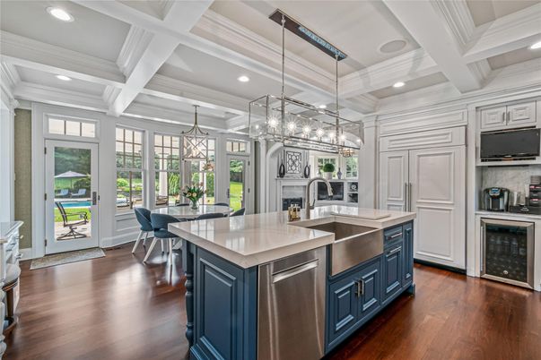 Chandelier, Dining room, Fireplace, Interior, Kitchen, Pendant Lights, Recessed Lighting, Stainless Steel Appliances, Wood Texture Flooring