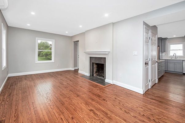 Empty room, Fireplace, Interior, Kitchen, Recessed Lighting, Wood Texture Flooring