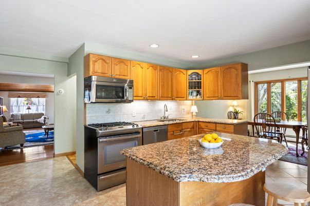 Dining room, Interior, Kitchen, Living room, Recessed Lighting, Stainless Steel Appliances, Wood Texture Flooring