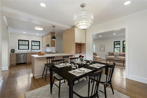 Chandelier, Dining room, Interior, Kitchen, Living room, Pendant Lights, Recessed Lighting, Stainless Steel Appliances, Wood Texture Flooring