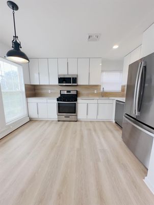 Interior, Kitchen, Pendant Lights, Recessed Lighting, Stainless Steel Appliances, Wood Texture Flooring