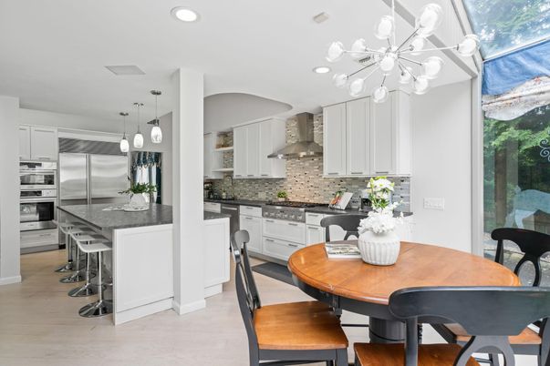 Dining room, Interior, Kitchen, Pendant Lights, Recessed Lighting, Stainless Steel Appliances, Wood Texture Flooring