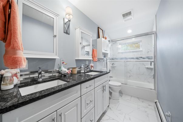 Bathroom, Dual Sink Vanities, Glass Shower, Interior, Marble, Marble Walls, Recessed Lighting