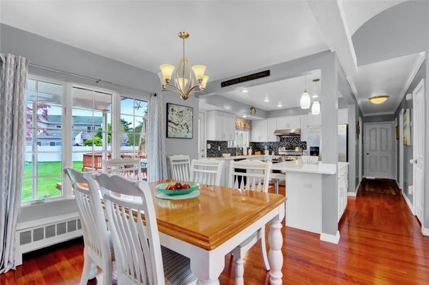 Chandelier, Dining room, Interior, Kitchen, Pendant Lights, Recessed Lighting, Stainless Steel Appliances, Wood Texture Flooring