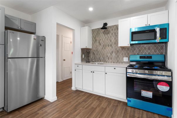 Interior, Kitchen, Recessed Lighting, Stainless Steel Appliances, Wood Texture Flooring