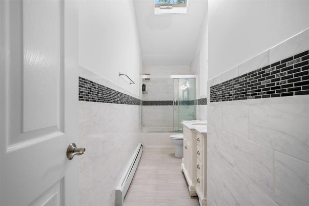 Bathroom, Glass Shower, Interior, Marble Walls, Wood Texture Flooring