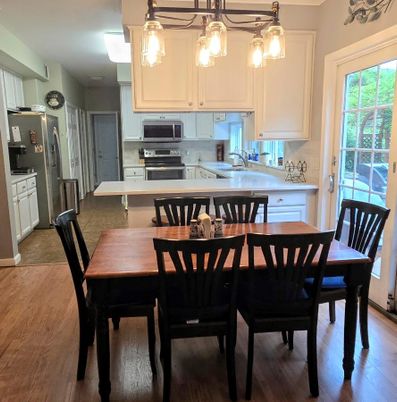 Dining room, Interior, Kitchen, Pendant Lights, Stainless Steel Appliances, Wood Texture Flooring