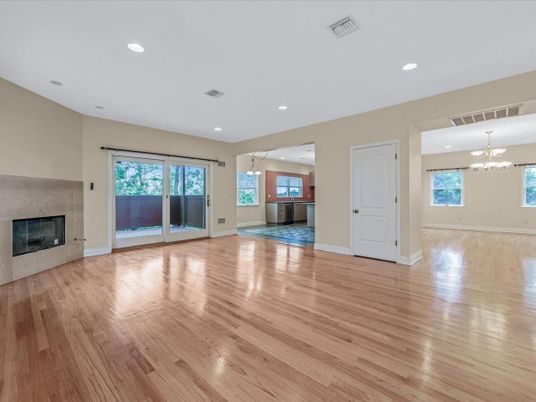 Chandelier, Empty room, Fireplace, Interior, Pendant Lights, Recessed Lighting, Wood Texture Flooring