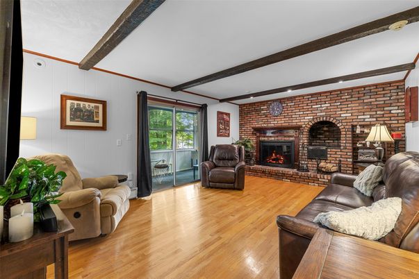 Fireplace, Interior, Living room, Recessed Lighting, Stone Walls, Wooden Beams, Wood Texture Flooring
