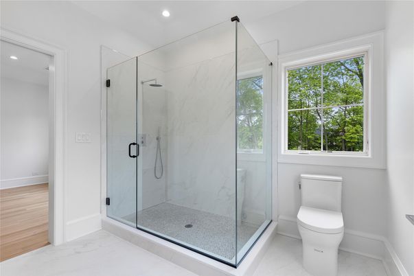 Bathroom, Glass Shower, Interior, Marble, Marble Walls, Recessed Lighting, Wood Texture Flooring