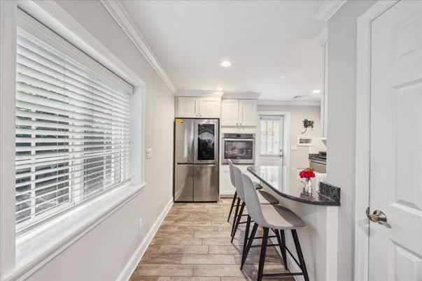 Interior, Kitchen, Recessed Lighting, Stainless Steel Appliances, Wood Texture Flooring