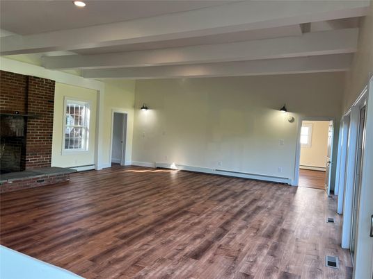 Empty room, Fireplace, Interior, Recessed Lighting, Stone Walls, Wood Texture Flooring