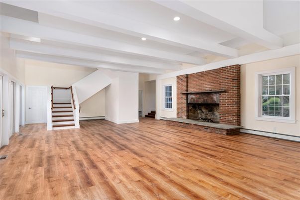 Empty room, Fireplace, Interior, Recessed Lighting, Stone Walls, Wood Texture Flooring