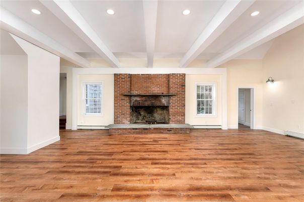 Empty room, Fireplace, Interior, Recessed Lighting, Stone Walls, Wood Texture Flooring