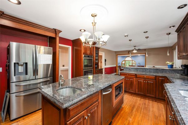 Chandelier, Interior, Kitchen, Pendant Lights, Recessed Lighting, Stainless Steel Appliances, Wood Texture Flooring