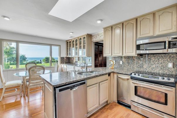 Dining room, Interior, Kitchen, Recessed Lighting, Stainless Steel Appliances, Water, Wood Texture Flooring