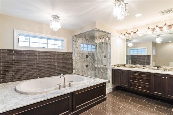 Bathroom, Chandelier, Dual Sink Vanities, Glass Shower, Interior, Marble Walls, Recessed Lighting