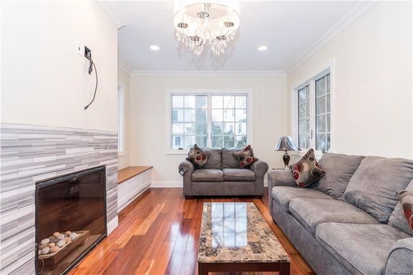 Chandelier, Fireplace, Interior, Living room, Recessed Lighting, Wood Texture Flooring