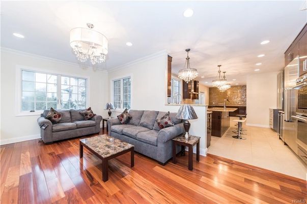 Chandelier, Interior, Kitchen, Living room, Recessed Lighting, Stainless Steel Appliances, Wood Texture Flooring