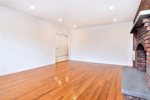 Empty room, Fireplace, Interior, Recessed Lighting, Wood Texture Flooring