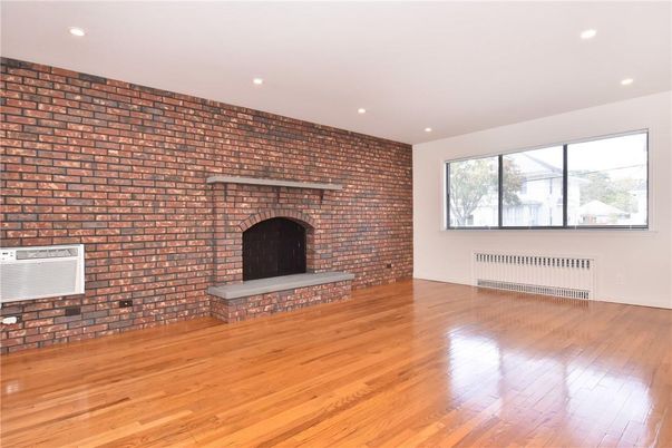 Empty room, Fireplace, Interior, Recessed Lighting, Stone Walls, Wood Texture Flooring