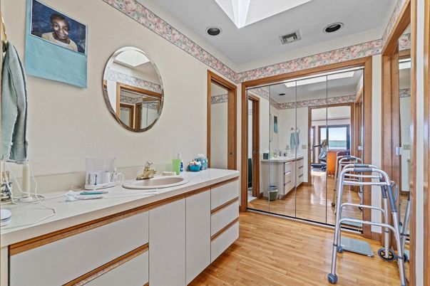 Bathroom, Dual Sink Vanities, Interior, Recessed Lighting, Wood Texture Flooring