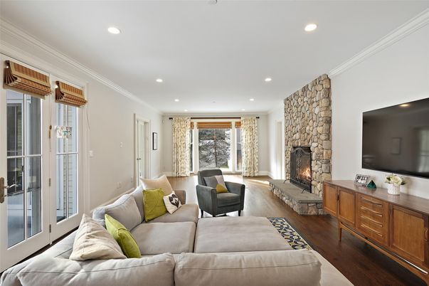 Fireplace, Interior, Living room, Recessed Lighting, Stone Walls, Wood Texture Flooring