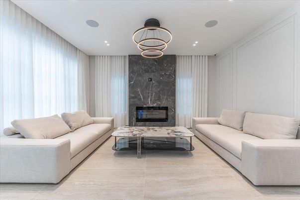 Fireplace, Interior, Living room, Marble Walls, Pendant Lights, Recessed Lighting, Wood Texture Flooring