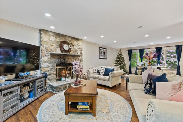 Fireplace, Interior, Living room, Recessed Lighting, Stone Walls, Wood Texture Flooring