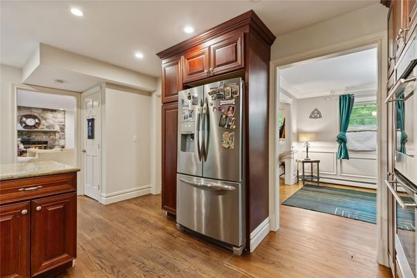 Fireplace, Interior, Kitchen, Recessed Lighting, Stainless Steel Appliances, Wood Texture Flooring