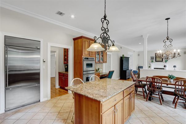 Chandelier, Dining room, Fireplace, Interior, Kitchen, Pendant Lights, Recessed Lighting, Stainless Steel Appliances, Wood Texture Flooring
