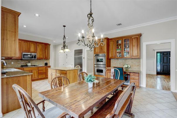 Chandelier, Dining room, Interior, Kitchen, Pendant Lights, Recessed Lighting, Stainless Steel Appliances, Wood Texture Flooring