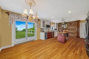 Chandelier, Interior, Kitchen, Recessed Lighting, Stainless Steel Appliances, Stone Walls, Wood Texture Flooring