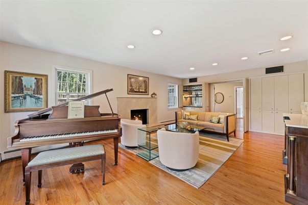 Fireplace, Interior, Living room, Piano, Recessed Lighting, Wood Texture Flooring