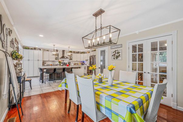Chandelier, Dining room, Interior, Kitchen, Pendant Lights, Recessed Lighting, Stainless Steel Appliances, Wood Texture Flooring
