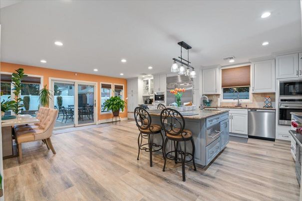 Dining room, Interior, Kitchen, Pendant Lights, Recessed Lighting, Stainless Steel Appliances, Wood Texture Flooring