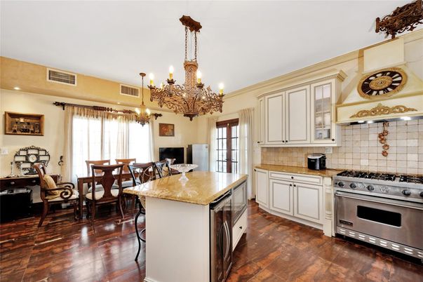 Chandelier, Dining room, Interior, Kitchen, Recessed Lighting, Stainless Steel Appliances, Wood Texture Flooring