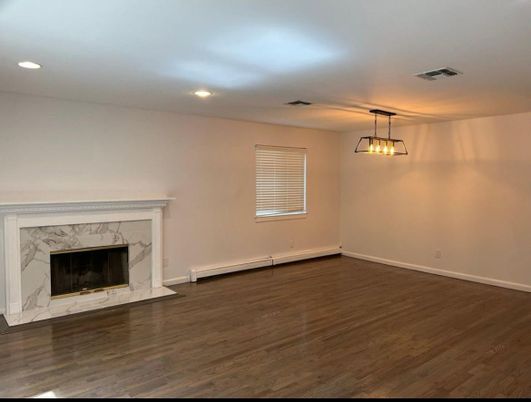 Empty room, Fireplace, Interior, Pendant Lights, Recessed Lighting, Wood Texture Flooring